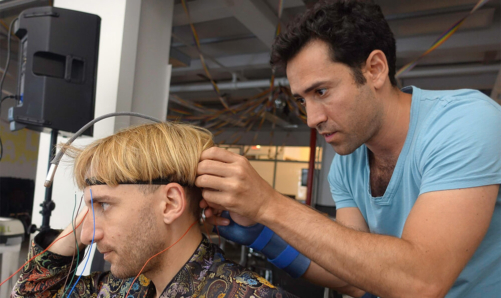 Artist Neil Harbisson working with engineer Oryan Inbar on a new ‘time sense’